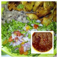A picture of Mashed beans with crispy fried sweet potatoes and palm oil stew.
