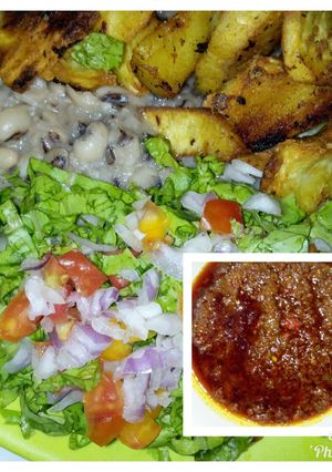 A picture of Mashed beans with crispy fried sweet potatoes and palm oil stew.