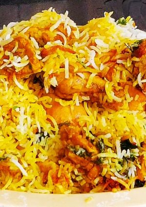 A picture of Layered chicken biryani step by step preparation.