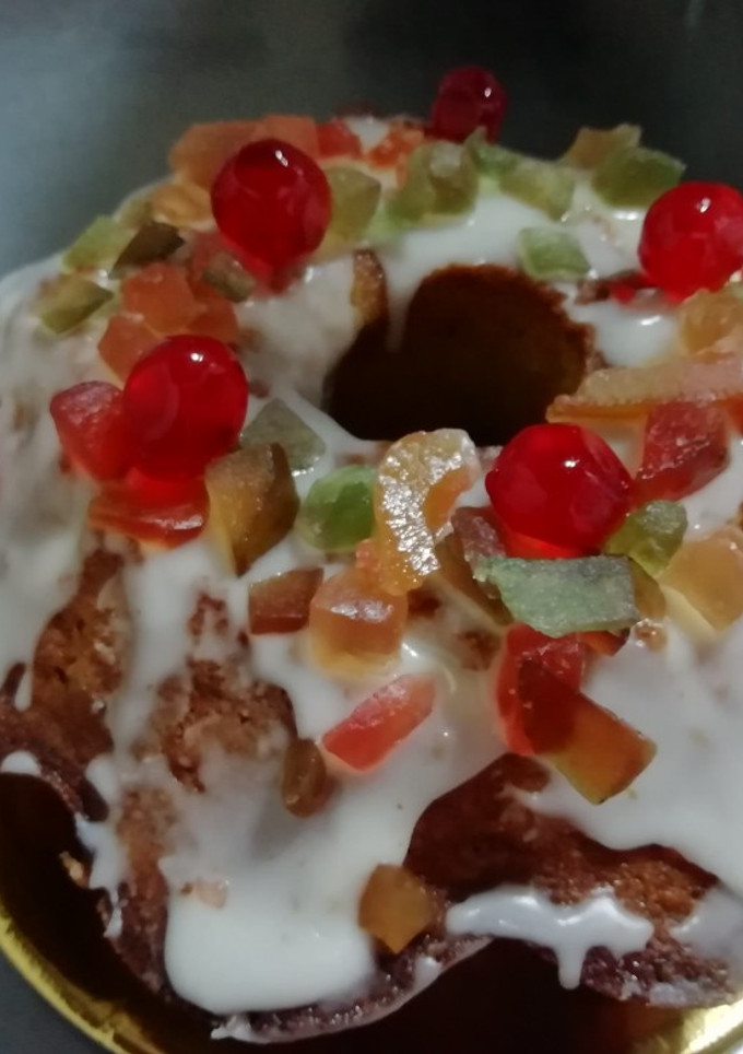 Una foto de Budín de Naranja 🍊 con frutas y glasé de Naranja 🍊