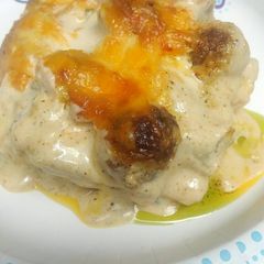 A picture of Alfredo Meatball Lasagna with Pesto.