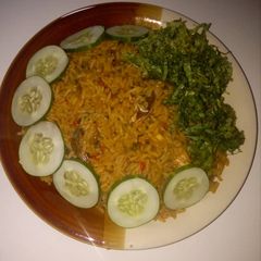 A picture of Red oil rice with cucumber and lectus.