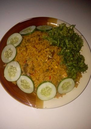 A picture of Red oil rice with cucumber and lectus.