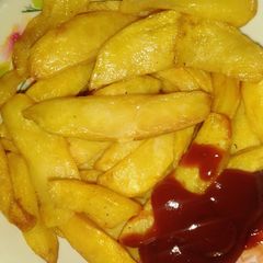 A picture of Chips with ketchup.