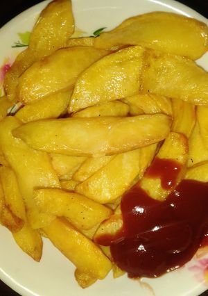 A picture of Chips with ketchup.
