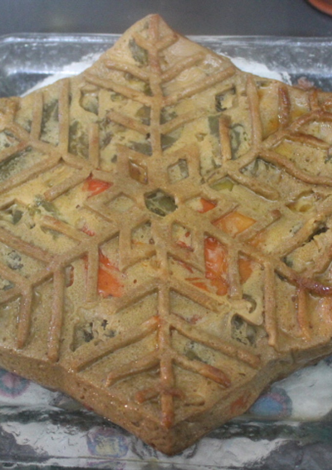 Una foto de Tortilla de pimientos con patata y remolacha