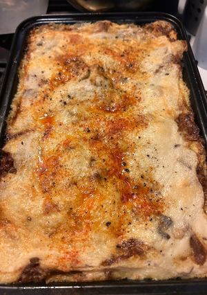 A picture of Lasagna with Pork Rib Ragù and Sautéed Mushrooms.