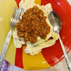 A picture of Alfredo fettuccine with bolognese sauce 🍝.