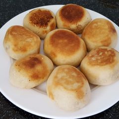 A picture of Peanuts bun, baked on the pan.