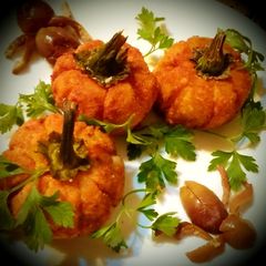 A picture of Potato croquettes stuffed with cheese and pumpkin seeds.