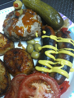 A picture of Bratwurst and Burgers.