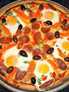 Una foto de Pizza a la flamenca