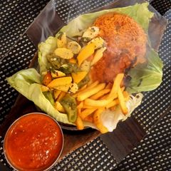 A picture of Paneer Shashkik Sizzler with Schezwan Corn Rice.