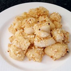 A picture of Mochi with ground peanuts.