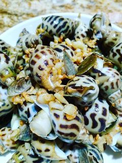 Hình của món Ốc hương xào bơ muối tỏi.