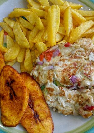 A picture of Chips, fried plantain & fried eggs.
