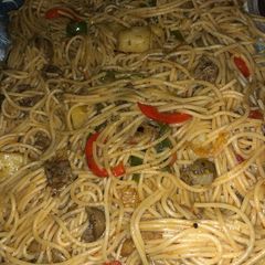 Spaghetti jollof with kidney and Irish potatoes A picture of Spaghetti jollof with kidney and Irish potatoes.