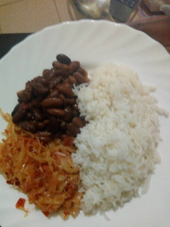A picture of Rice beans and fried cabbage.