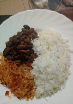 A picture of Rice beans and fried cabbage.