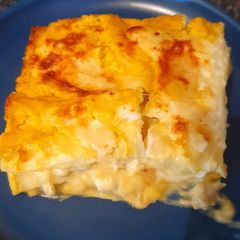 A picture of Lasagna with pumpkin and sausage.