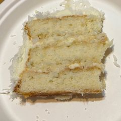 A picture of Coconut Cake w/ Cream Cheese Frosting.