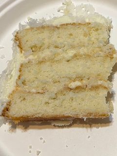 A picture of Coconut Cake w/ Cream Cheese Frosting.