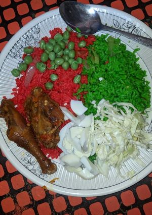 A picture of Multi coloured jelouf rice and chicken pepper.