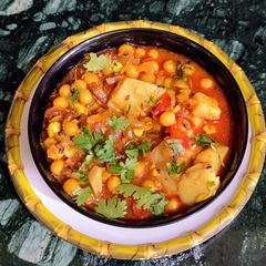 A picture of Potato, Dry Yellow Peas Curry (Aloo, Yellow Matar Subzi).