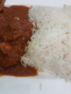 A picture of Chicken stew and rice.