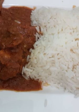 A picture of Chicken stew and rice.
