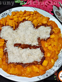 A picture of Date,coconut,mango,mango salat.