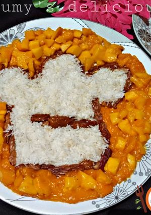 A picture of Date,coconut,mango,mango salat.