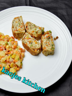 A picture of Egg rolls and potato salad.