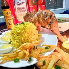 A picture of Badami steam tikka with spicy rice.