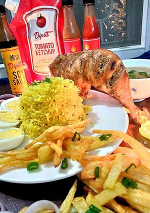 A picture of Badami steam tikka with spicy rice.