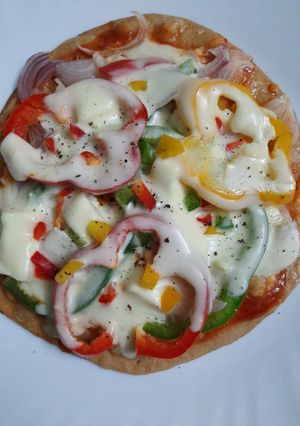 A picture of Thin Crust Paneer Pizza.