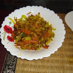 A picture of Stir fry cabbage and carrot.