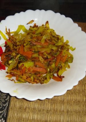 A picture of Stir fry cabbage and carrot.