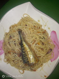 A picture of Spaghetti jollof and ice fish.