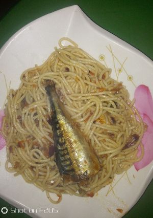 A picture of Spaghetti jollof and ice fish.