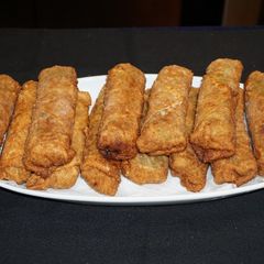 A picture of Shrimp eggrolls with shiitake mushrooms.