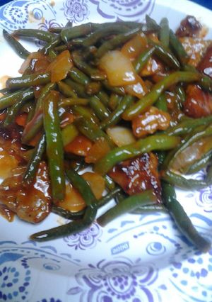 A picture of Green Beans and Sausage in a Sauce.