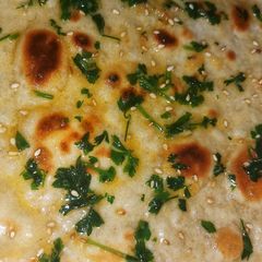 A picture of Garlic Naan bread.