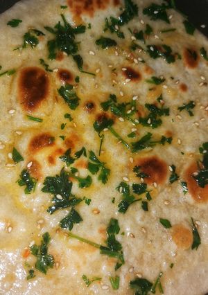 A picture of Garlic Naan bread.