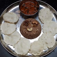 A picture of Chettinad Vellai Paniyaram with Spicy Chilli Garlic chutney and Red Rice Puttu.