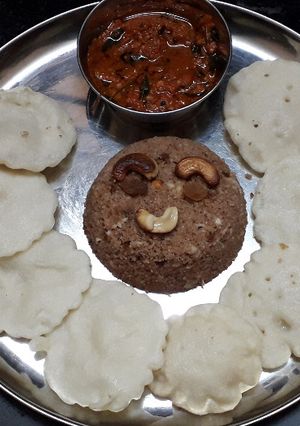 A picture of Chettinad Vellai Paniyaram with Spicy Chilli Garlic chutney and Red Rice Puttu.