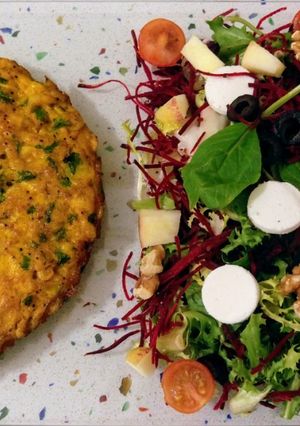 A picture of Shrimp Omelette with Mixed Greens Salad.