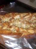 Chicken Alfredo in a garlic parm & herb bread bowl