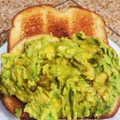 A picture of "Brioched style" toasted bread with Avocado & maple syrup.
