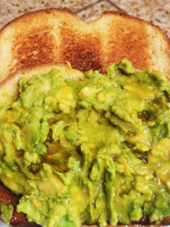 A picture of "Brioched style" toasted bread with Avocado & maple syrup.